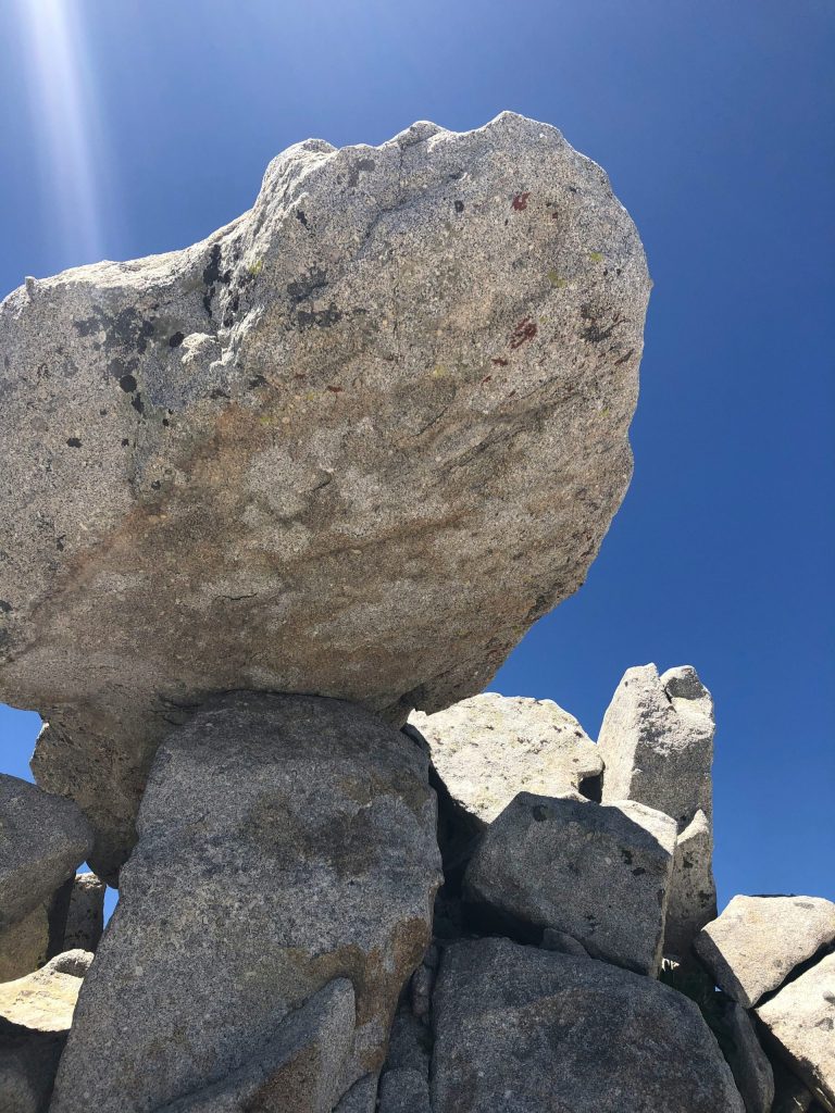 a large rock sitting on top of a pile of rocks