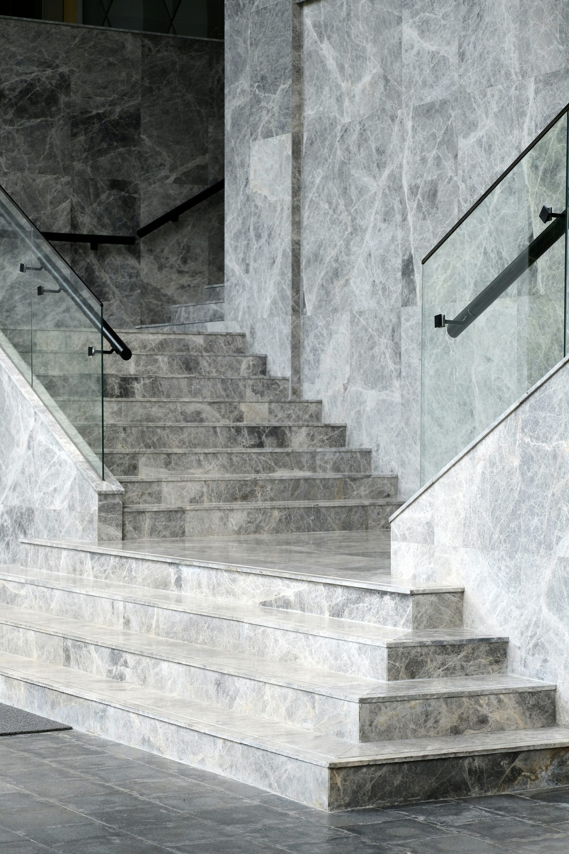 a stone staircase with a stone wall